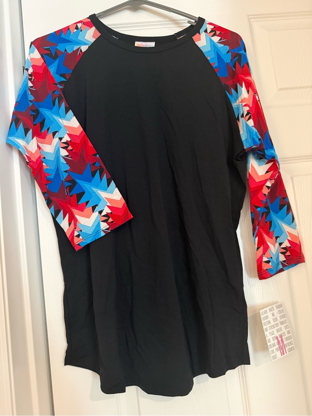 LuLaRoe Randy Black Raglan Top with Red & Blue Geo-Print Star Sleeves
